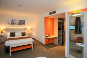 Postel nebo postele na pokoji v ubytování Best Western Colmar Expo
