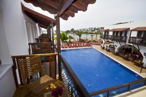 a view of a swimming pool from a balcony at Costa Bitezhan Hotel - All Inclusive in Bitez