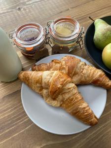 a plate of croissants and apples on a table at Cold Kitchen View in Longbridge Deverill +17 photos