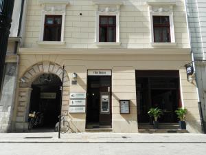 a building with an entrance to a building with windows at Pokoje Gościnne Św. Anny in Krakow