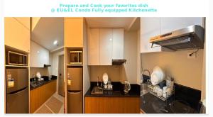 una cucina con mobili bianchi e un frigorifero in acciaio inossidabile di Eu & El Cozy Condo a Manila