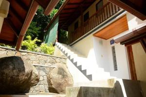 a stairway leading to a house with a building at Tranquil Retreat in Unawatuna