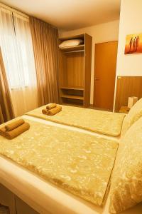 Ένα ή περισσότερα κρεβάτια σε δωμάτιο στο Melannie's Apartment
