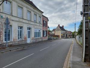 an empty street in a town with buildings at Gîte St Gobain in Saint-Gobain