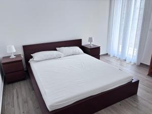 Postel nebo postele na pokoji v ubytování Plaza SUITE