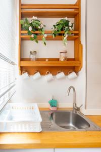 a kitchen counter with a sink and a sink at Santander Centro in Santander