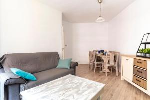 a living room with a couch and a table at Santander Centro in Santander +23 photos