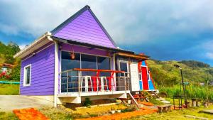a purple house with a purple roof at Kundasang Farmhouse in Kampong Kundassan