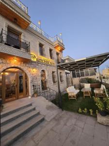 an entrance to a building with a patio at Elite Rose Cappadocia in Uchisar +146 photos