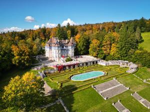 an aerial view of an estate with a swimming pool at Château des Avenieres in Cruseilles