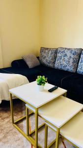 a living room with a couch and a table at Dorihomes in Mtwapa