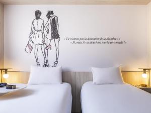 Ένα ή περισσότερα κρεβάτια σε δωμάτιο στο ibis Styles Sceaux Paris Sud