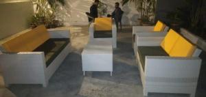 a group of tables and benches in a building at Hotel BlueSky Clifton 2 in Dargai