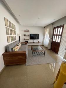a living room with a couch and a coffee table at Sandalwood Property in Lusaka