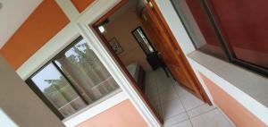 an empty room with a window and a bathroom at El Balcón in Catarina