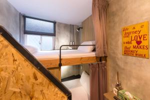 Postel nebo postele na pokoji v ubytování Beimen WOW Poshtel