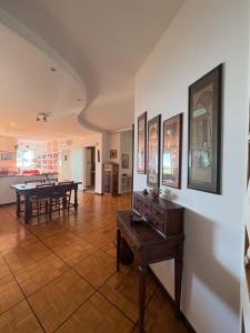 a living room with a table and a dining room at Casa Bonomea in Trieste