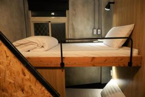 Postel nebo postele na pokoji v ubytování Beimen WOW Poshtel