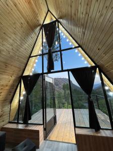 a room with a large window in a house at Green Garden 