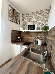 Kuchyň nebo kuchyňský kout v ubytování Appartement proche grands Buffets