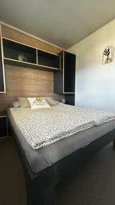 a bedroom with a large bed in a room at Villa 11 Limoni in Sukošan