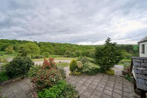 an aerial view of a garden with bushes and trees at Host & Stay - Coombe Cottage in Knowstone