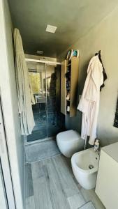 a bathroom with a shower and a toilet and a sink at Frascati Tower B&B in Frascati