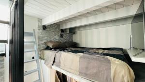 a bedroom with a bunk bed in a room at Frascati Tower B&B in Frascati