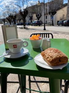a table with a cup of coffee and a plate of food at Casale Vista Mutria in Vinchiaturo