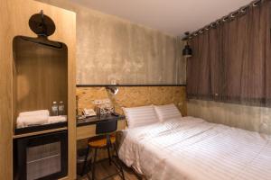 Postel nebo postele na pokoji v ubytování Beimen WOW Poshtel