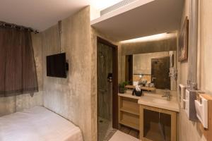 Postel nebo postele na pokoji v ubytování Beimen WOW Poshtel
