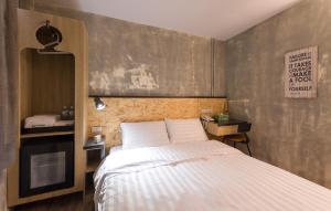 Postel nebo postele na pokoji v ubytování Beimen WOW Poshtel