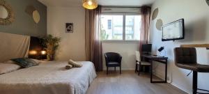 Postel nebo postele na pokoji v ubytování Le KOZY - Climatisation - Parking Gratuit