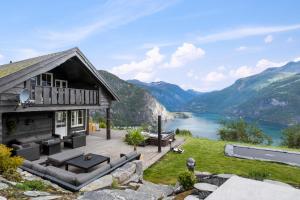 a house on a hill with a view of a lake at Lingåsen Panorama! in Valldal