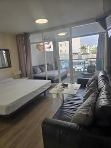 Ένα ή περισσότερα κρεβάτια σε δωμάτιο στο Apartamento Yumbo Roque Nublo