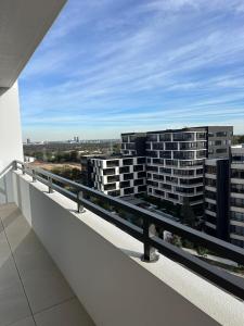 a balcony with a view of some buildings at FREE Parking Modern 2 bedrooms Apt for Family or Business in Sydney +2 photos