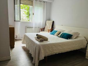 Ένα ή περισσότερα κρεβάτια σε δωμάτιο στο Espaciosa y Luminosa