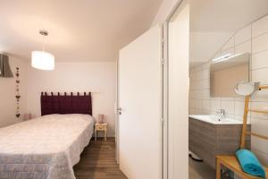 En eller flere senge i et værelse på Appartement Lac D'annecy À Sevrier