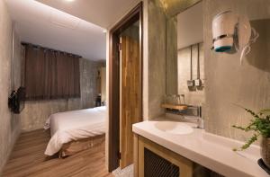 Postel nebo postele na pokoji v ubytování Beimen WOW Poshtel