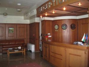 a judge courtroom with a couch and a bench at Hotel Elegance in Asenovgrad