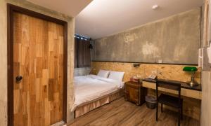 Postel nebo postele na pokoji v ubytování Beimen WOW Poshtel