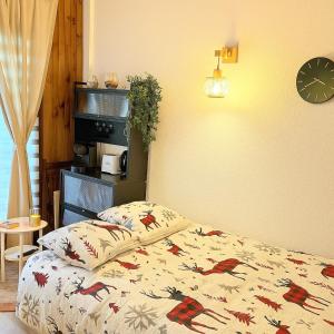 Postel nebo postele na pokoji v ubytování Famili'ski - Votre cocon familial aux Angles