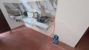 a room with a counter with a appliance on it at Kulassa Homes in Anuradhapura