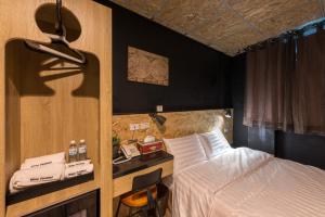 Postel nebo postele na pokoji v ubytování Beimen WOW Poshtel