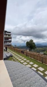 a view from the balcony of a house at Glamping Sarangan in Sarangan +4 photos