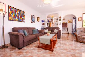 a living room with two couches and a table at Villa Sa Cabaneta by Slow Villas in La Cabaneta +86 photos