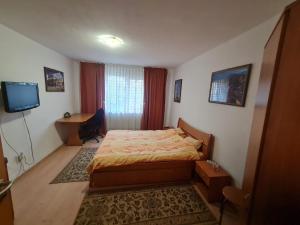 Ένα ή περισσότερα κρεβάτια σε δωμάτιο στο Timisoara
