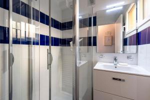 a bathroom with a sink and a shower at Casa Serena - 800m de la Plage in Porticcio +8 photos
