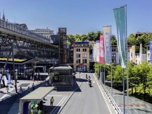 a city street with a bus on the street at ibis Styles Lausanne Center MadHouse in Lausanne