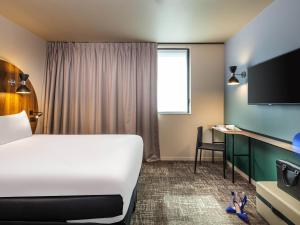Postel nebo postele na pokoji v ubytování ibis Styles Paris Meteor Avenue d'Italie + 86 fotografií